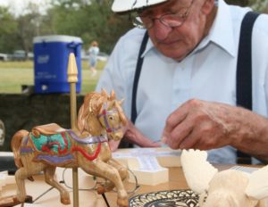 Man creating wooden toys and crafts